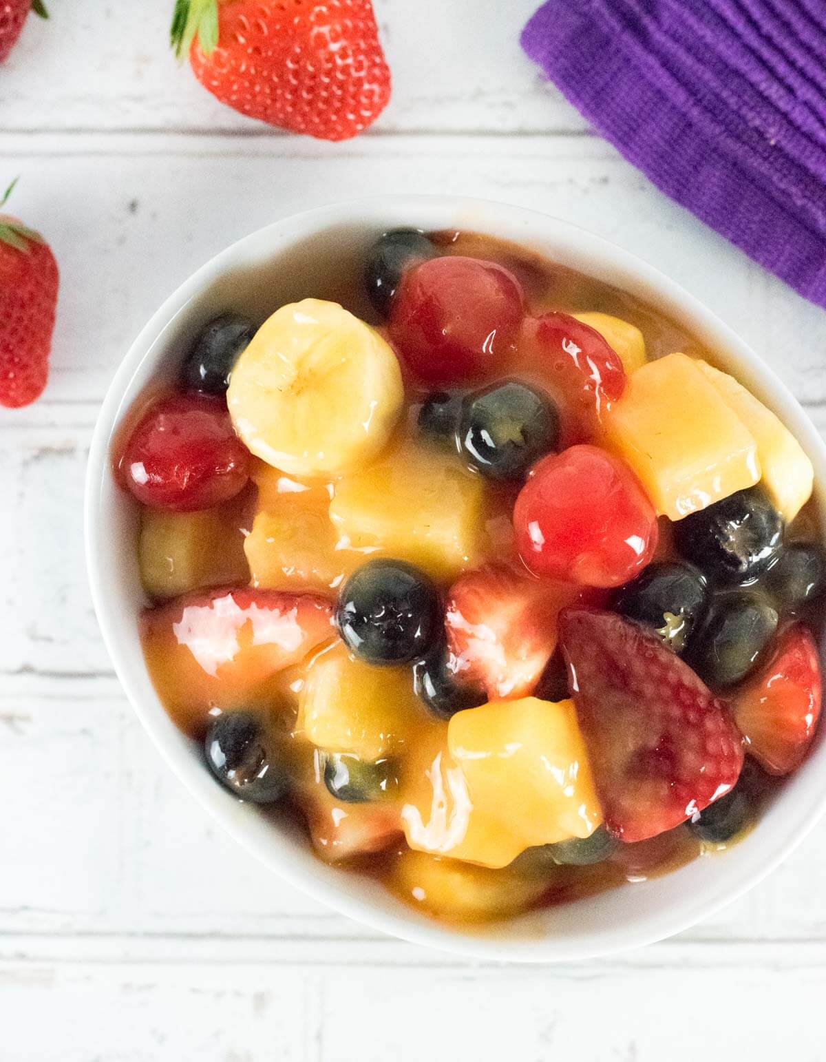 Fruit Salad sauce in dish with fresh strawberries