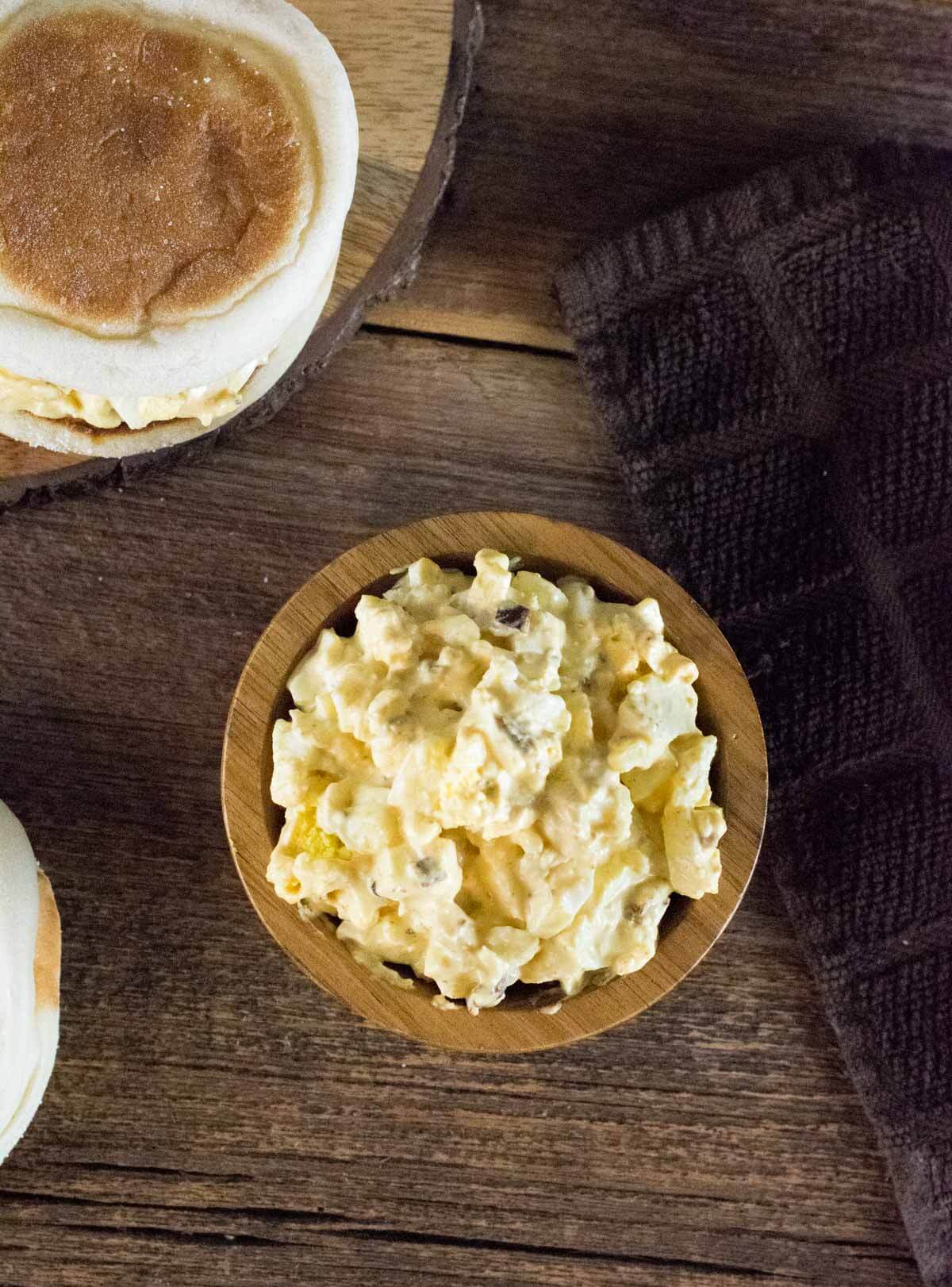 Egg salad in a wooden dish.