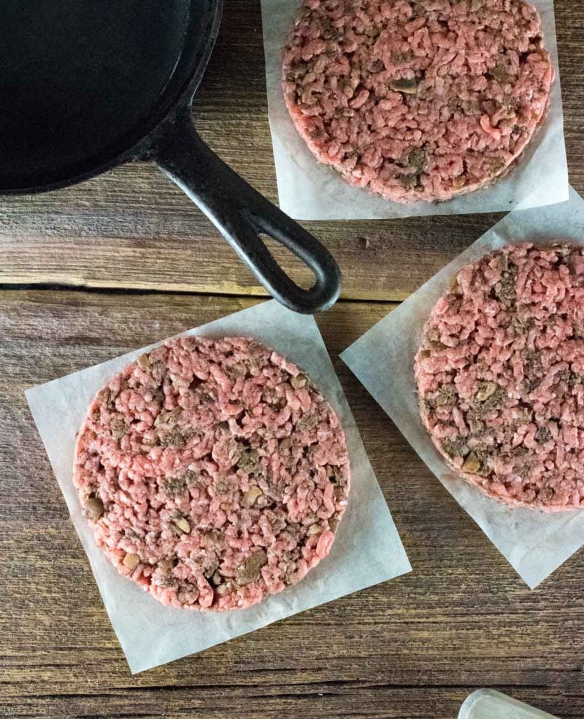 Three Blended burger patties on wax paper.