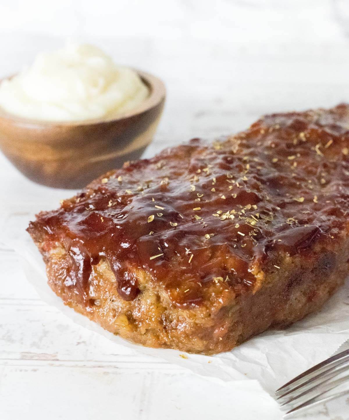 Sausage Meatloaf shown with mashed potatoes.