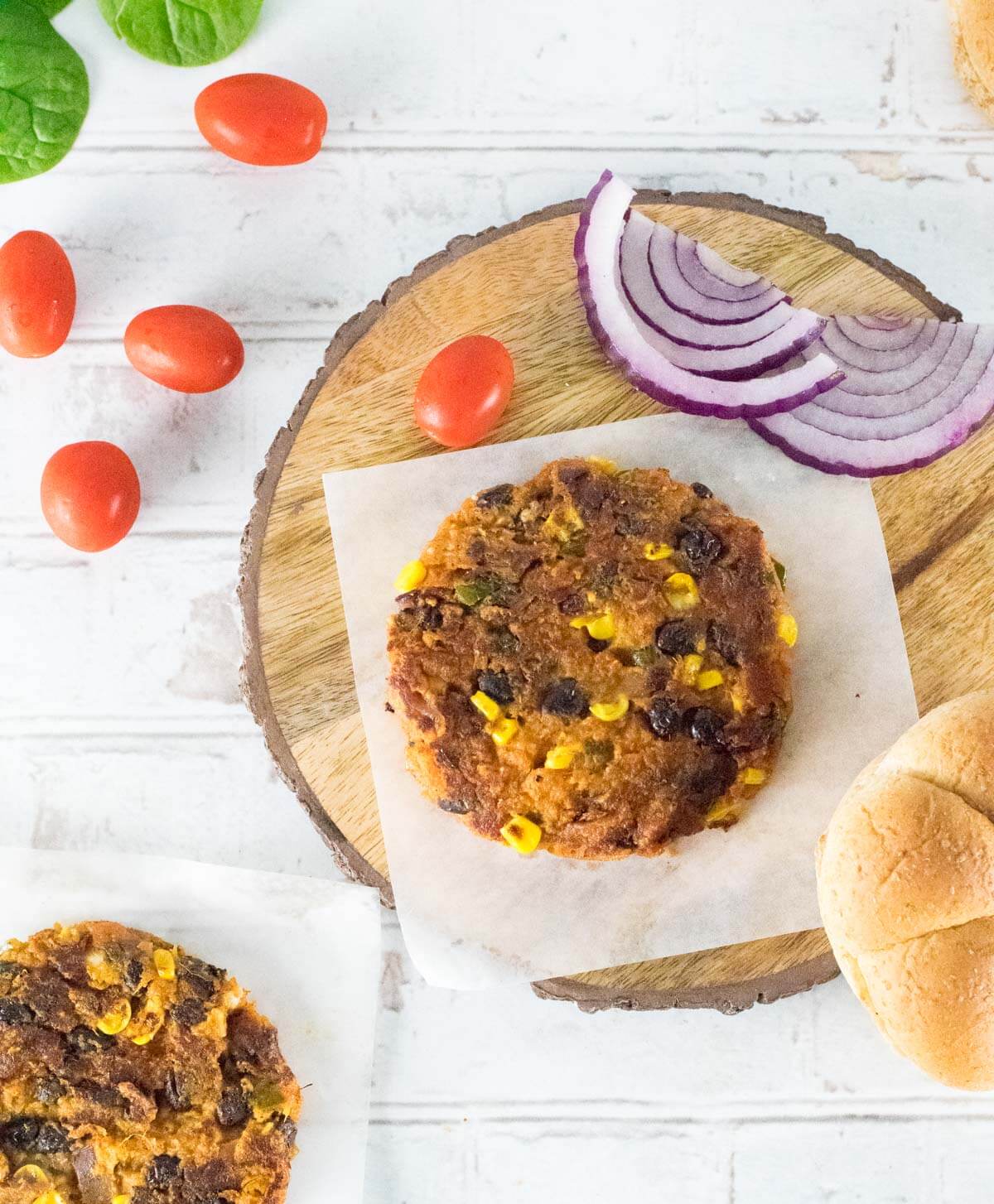 Vegetarian burger patty sitting on wax paper viewed from above.