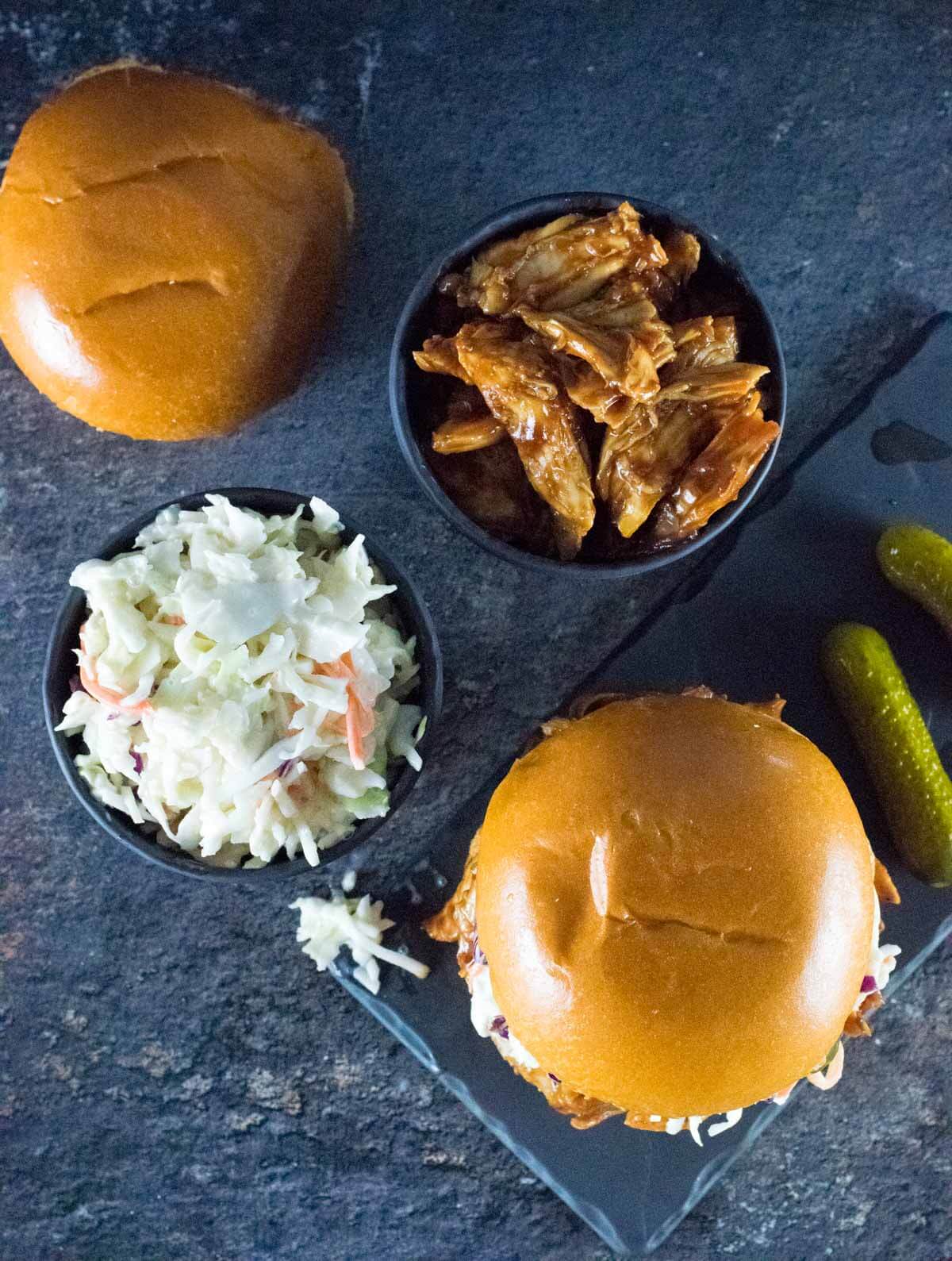 BBQ Pulled Chicken and slaw with pickles on the side.