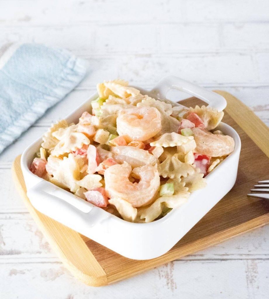 Cajun shrimp pasta salad without seasoning on top with white background.