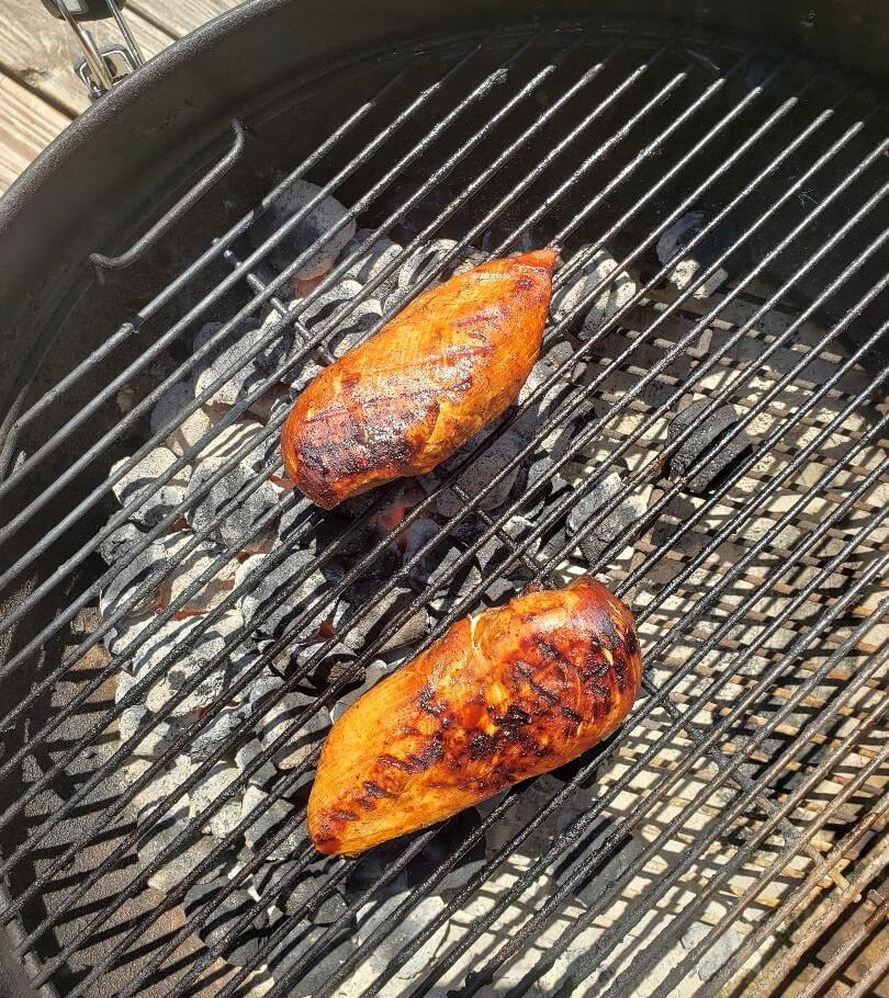 Chicken on charcoal grill.