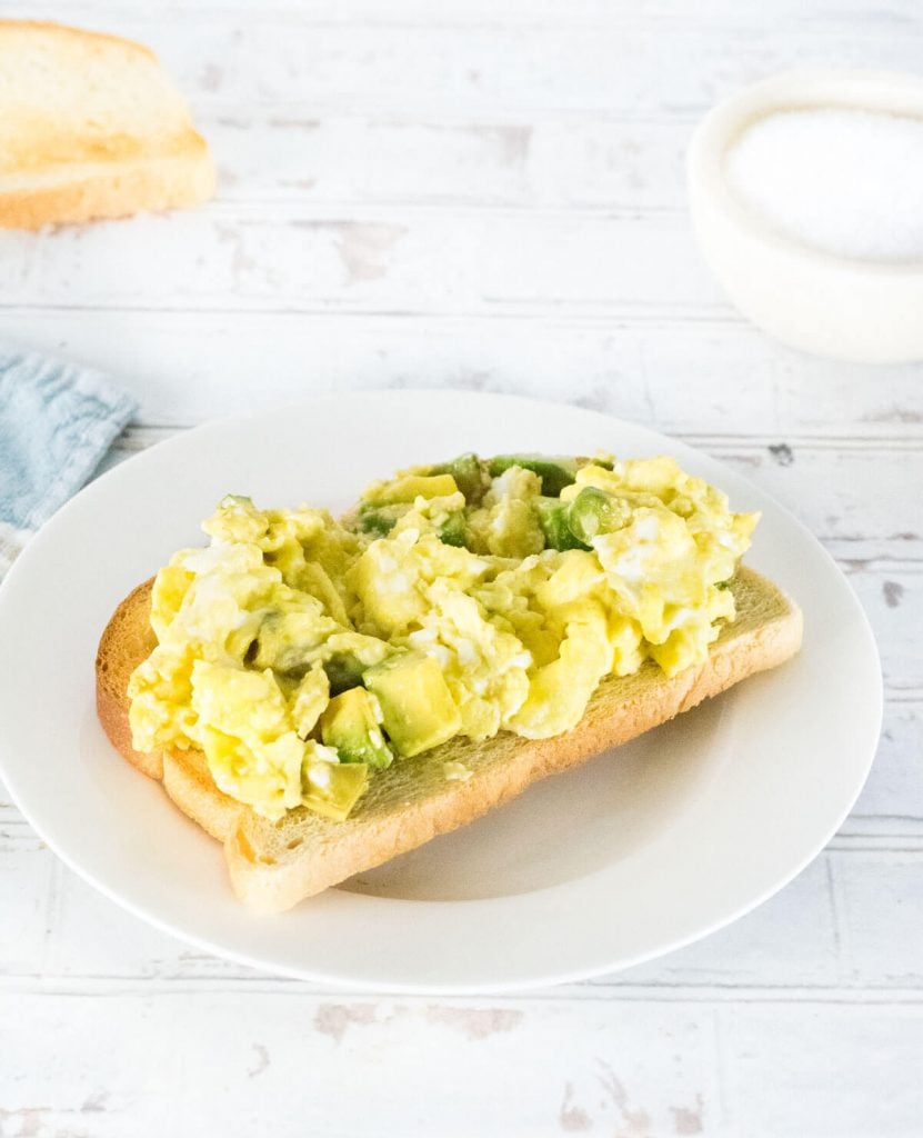 Avocado Scrambled Eggs on toast served for breakfast.