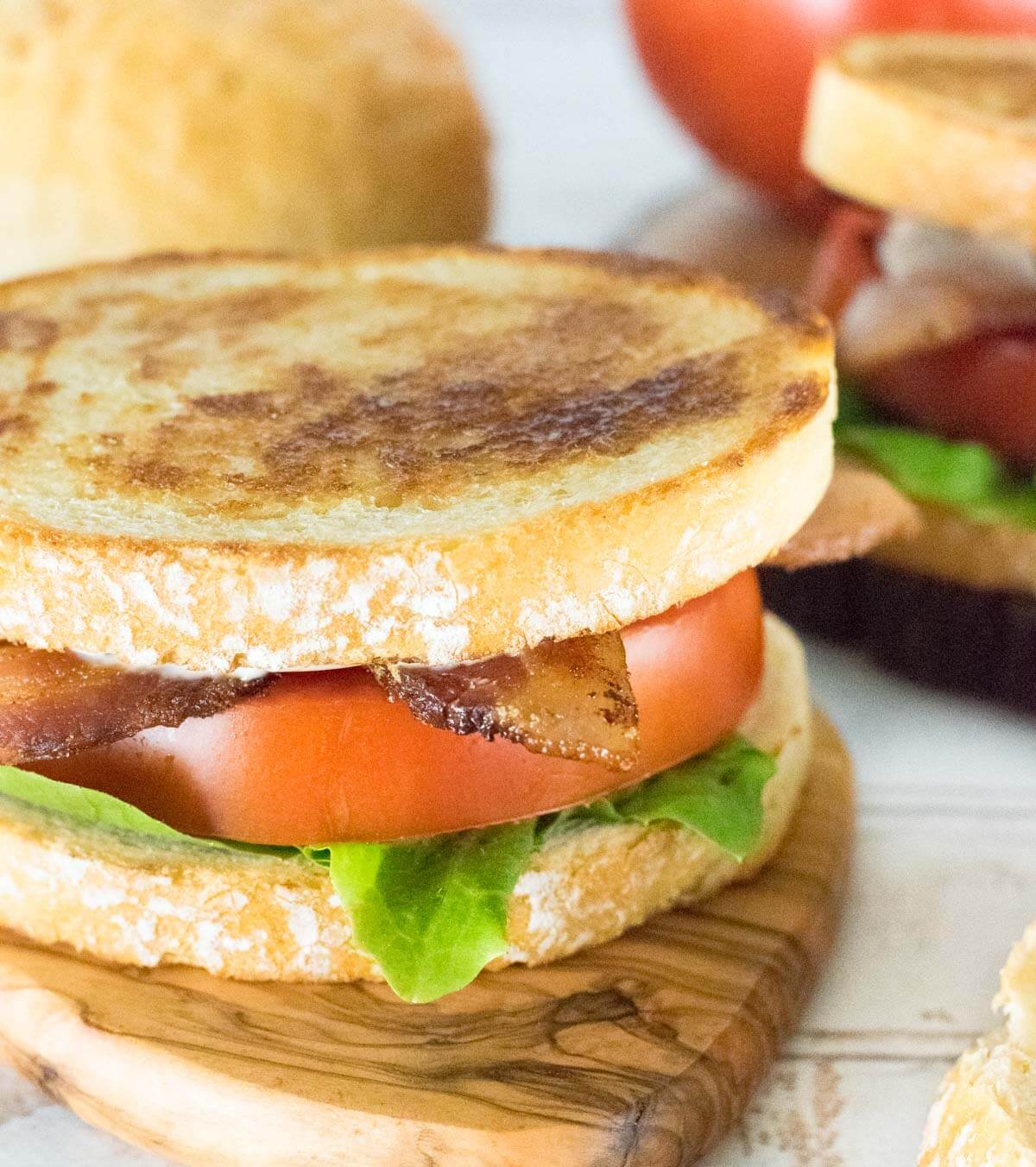 Ultimate BLT close up with thick cut bacon and ripe tomato.