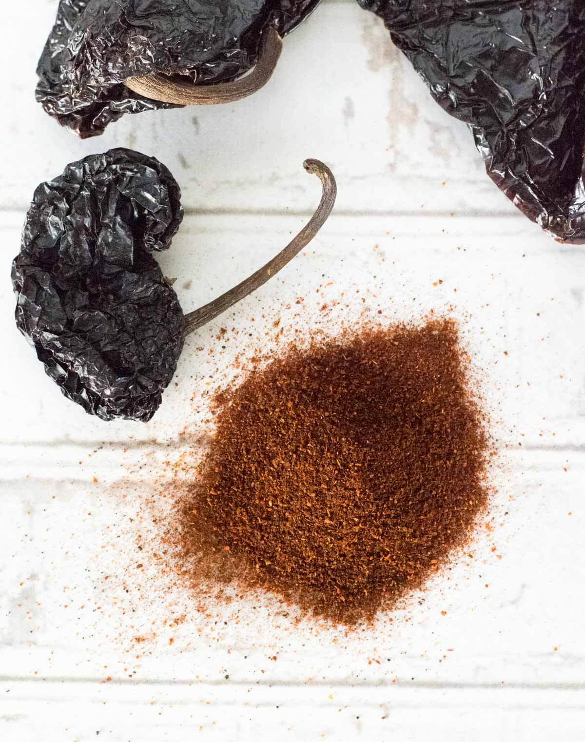 Ancho chili powder with dried peppers and seasoning