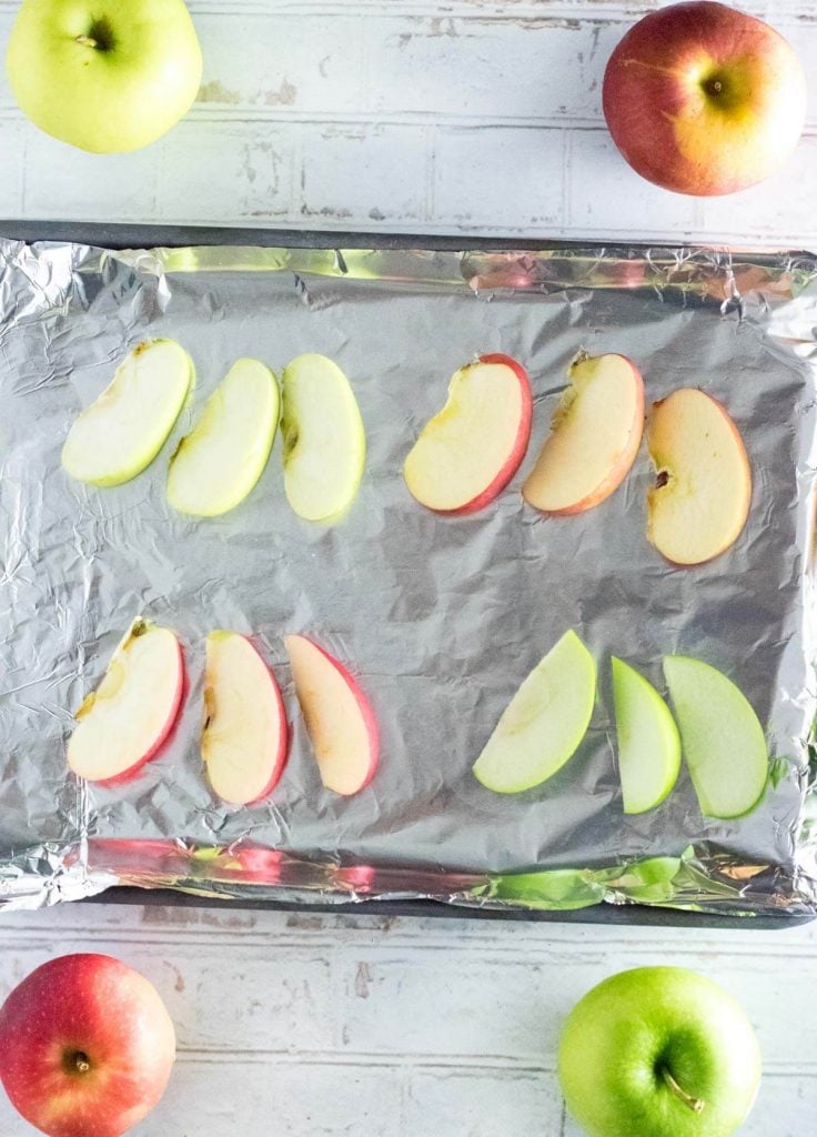 sliced apples on baking pan.