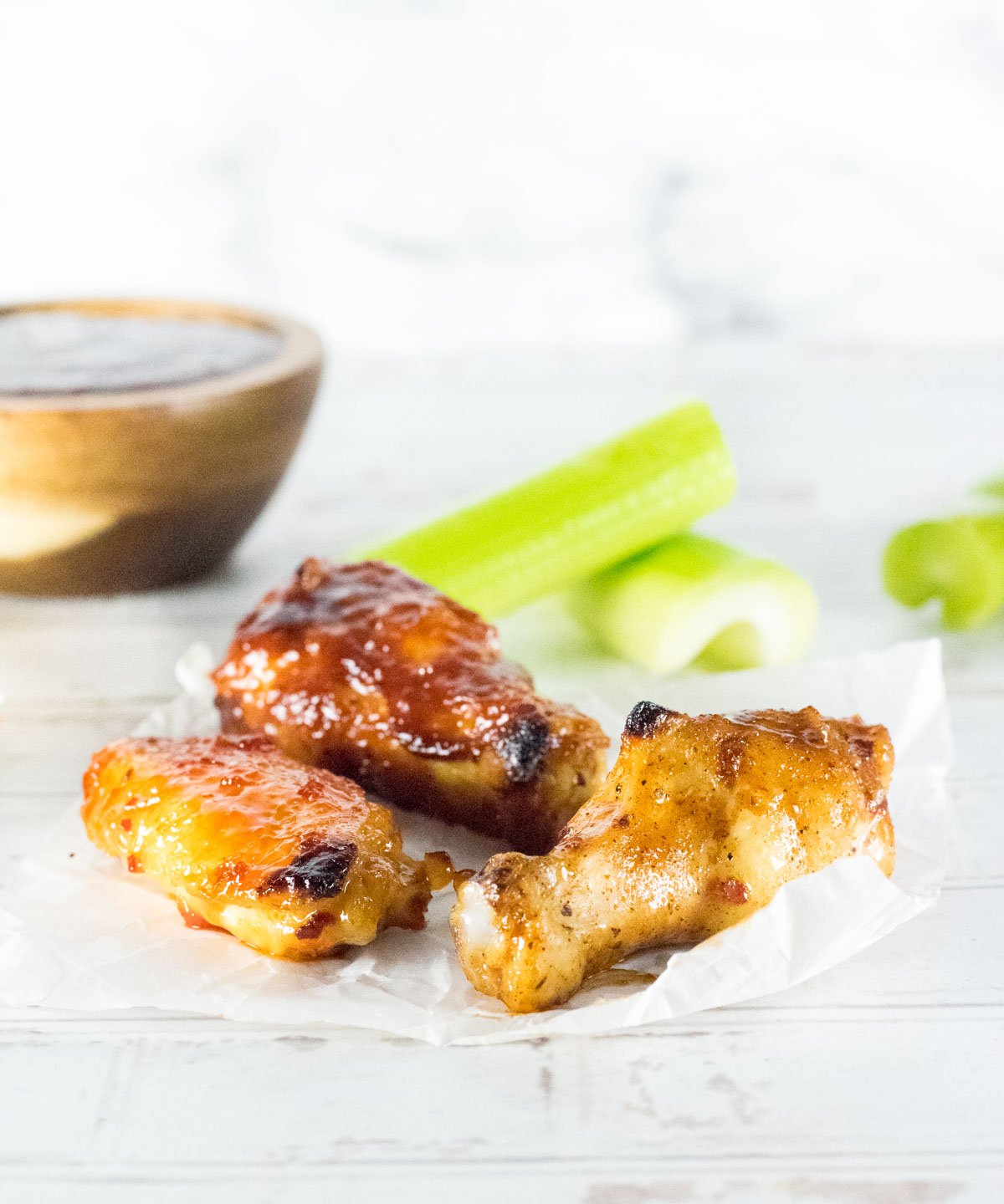 Broiled Chicken Wings on crumpled wax paper.