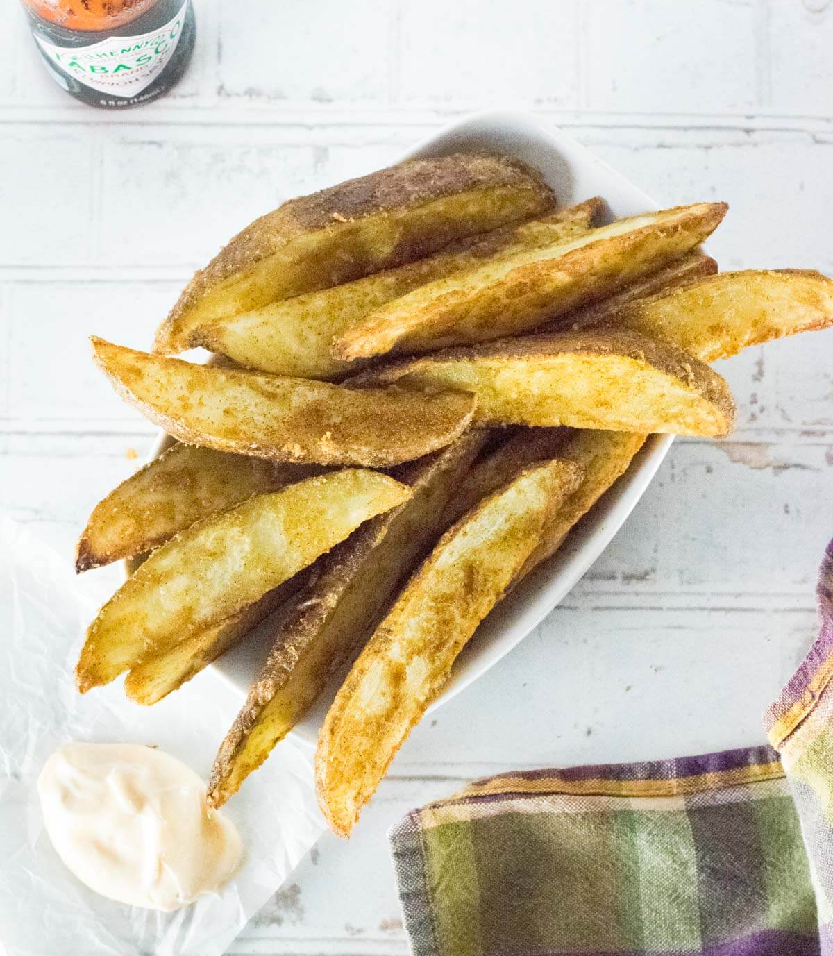 Cajun fries viewed from above with cajun mayo.