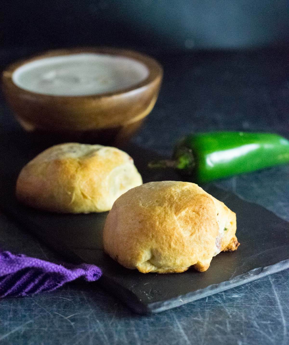 Jalapeno Popper Bites on black platter.