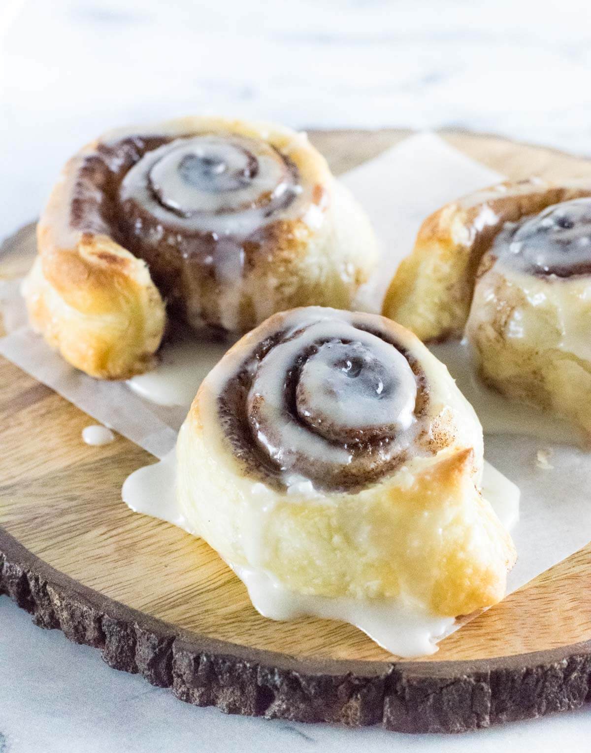 Puff Pastry Cinnamon Rolls recipe on wooden board.