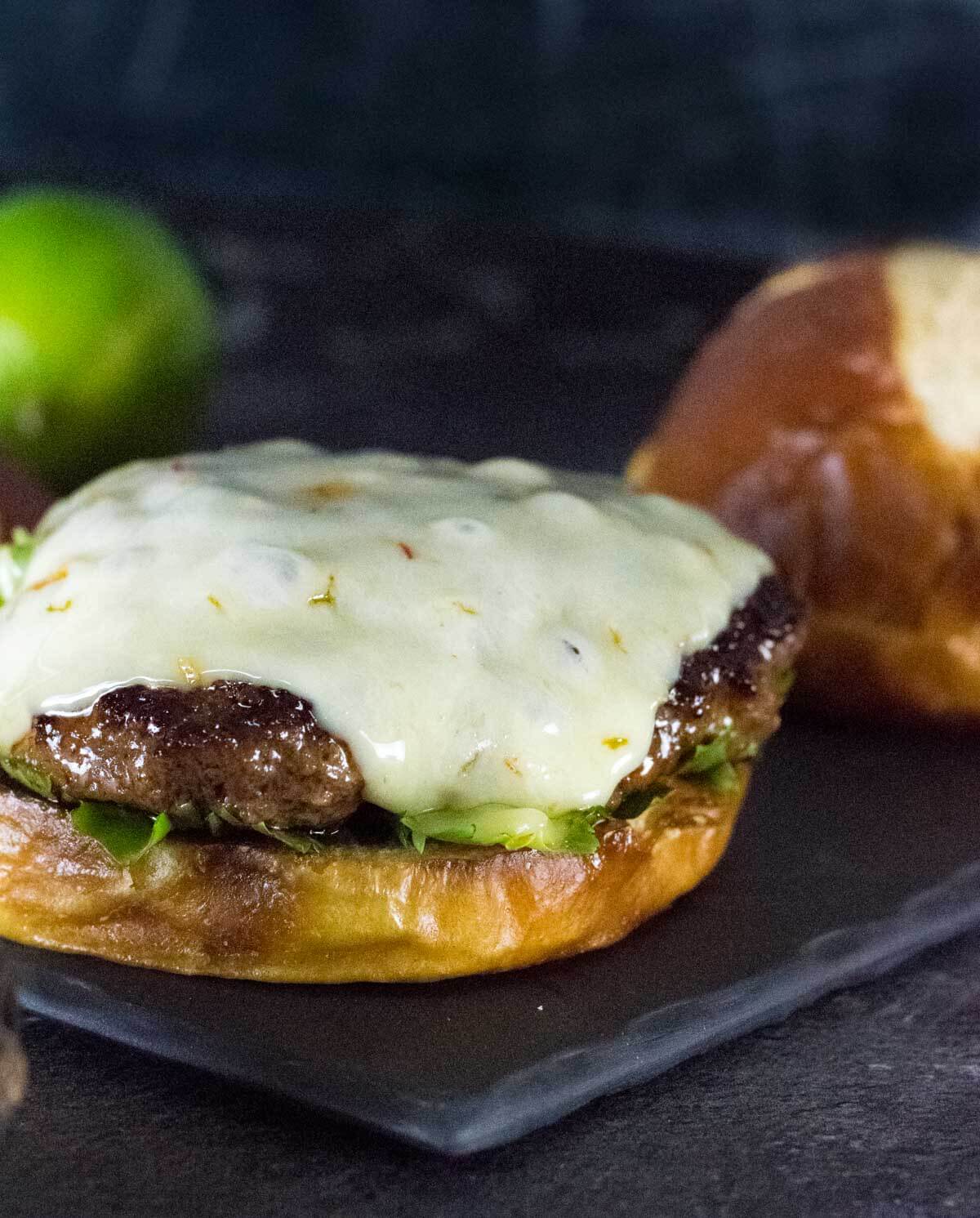Mexican Burger with cheese and no top bun.