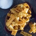 Fried wonton strips shown from above with dark background.