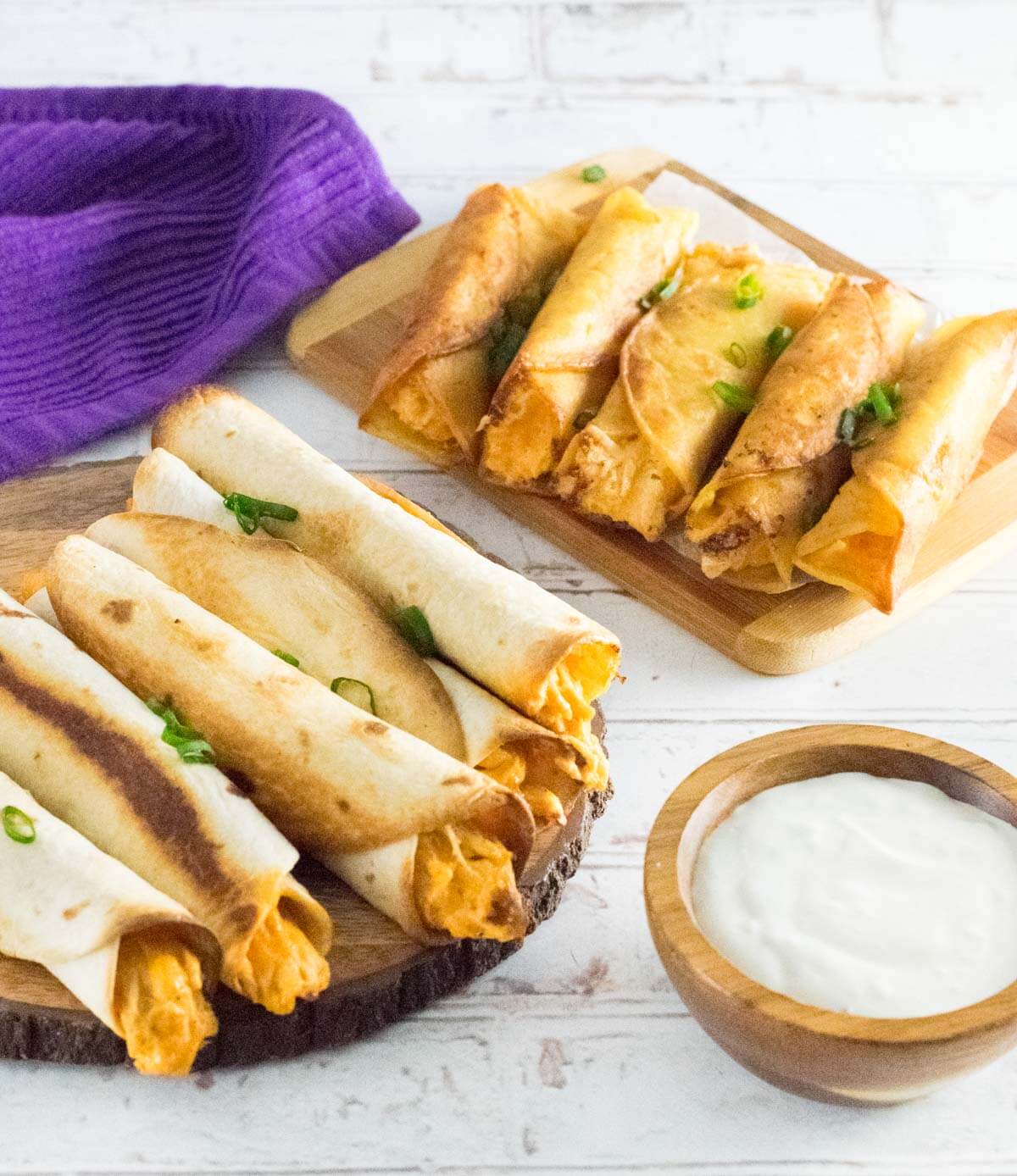 Buffalo chicken taquitos on two platters showing them baked and fried.