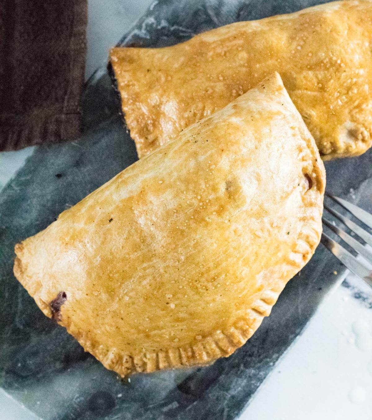 Two Cornish pasties shown from above.