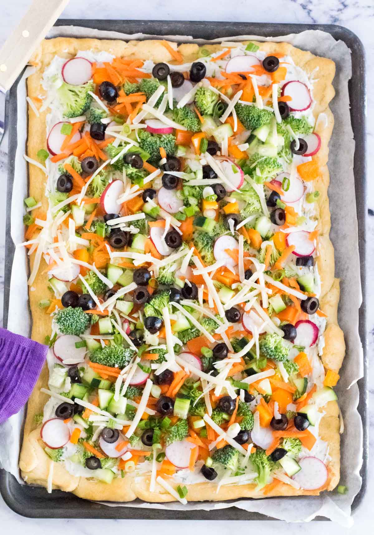 Crescent roll veggie pizza shown from above.