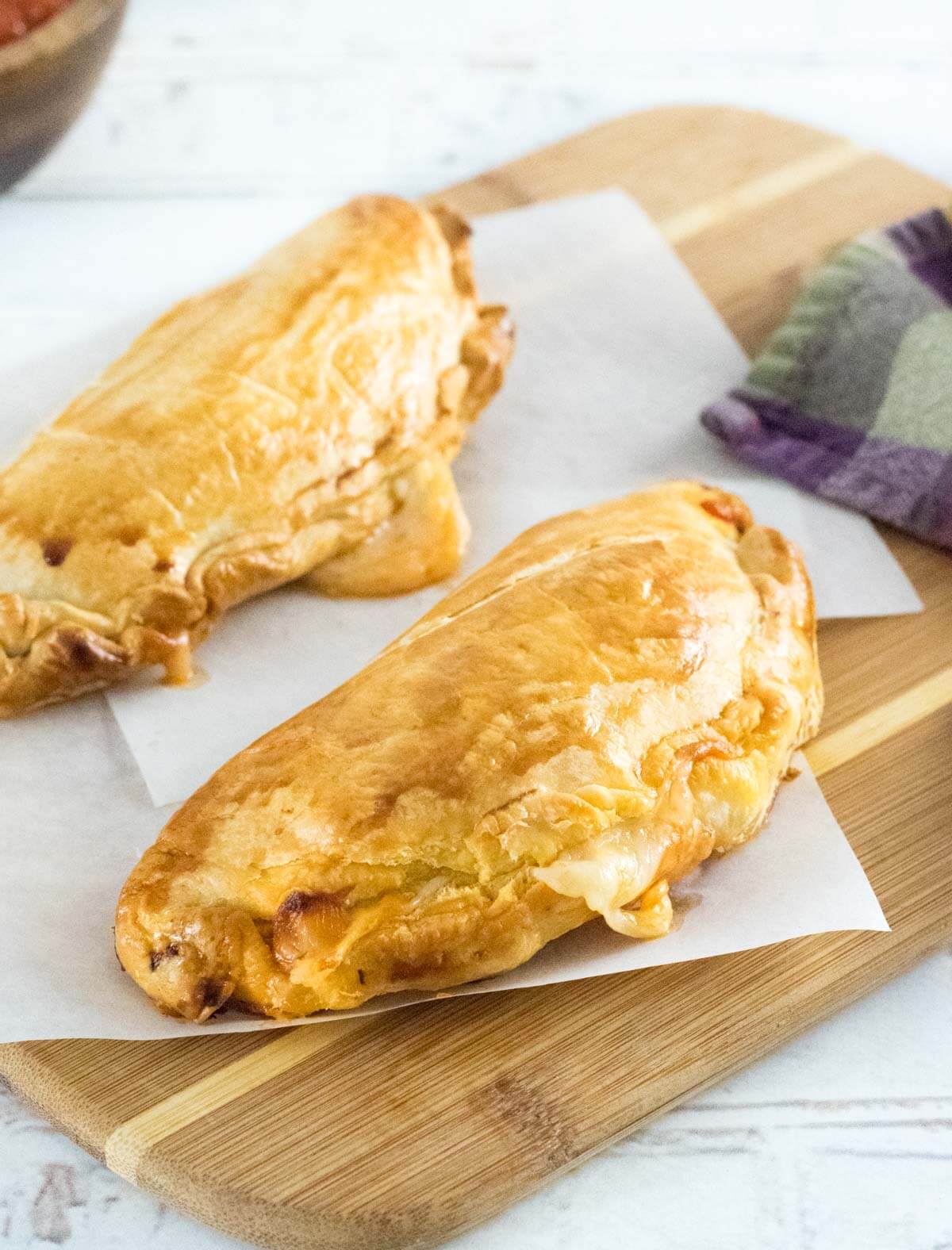 Homemade hot pockets on cutting board.