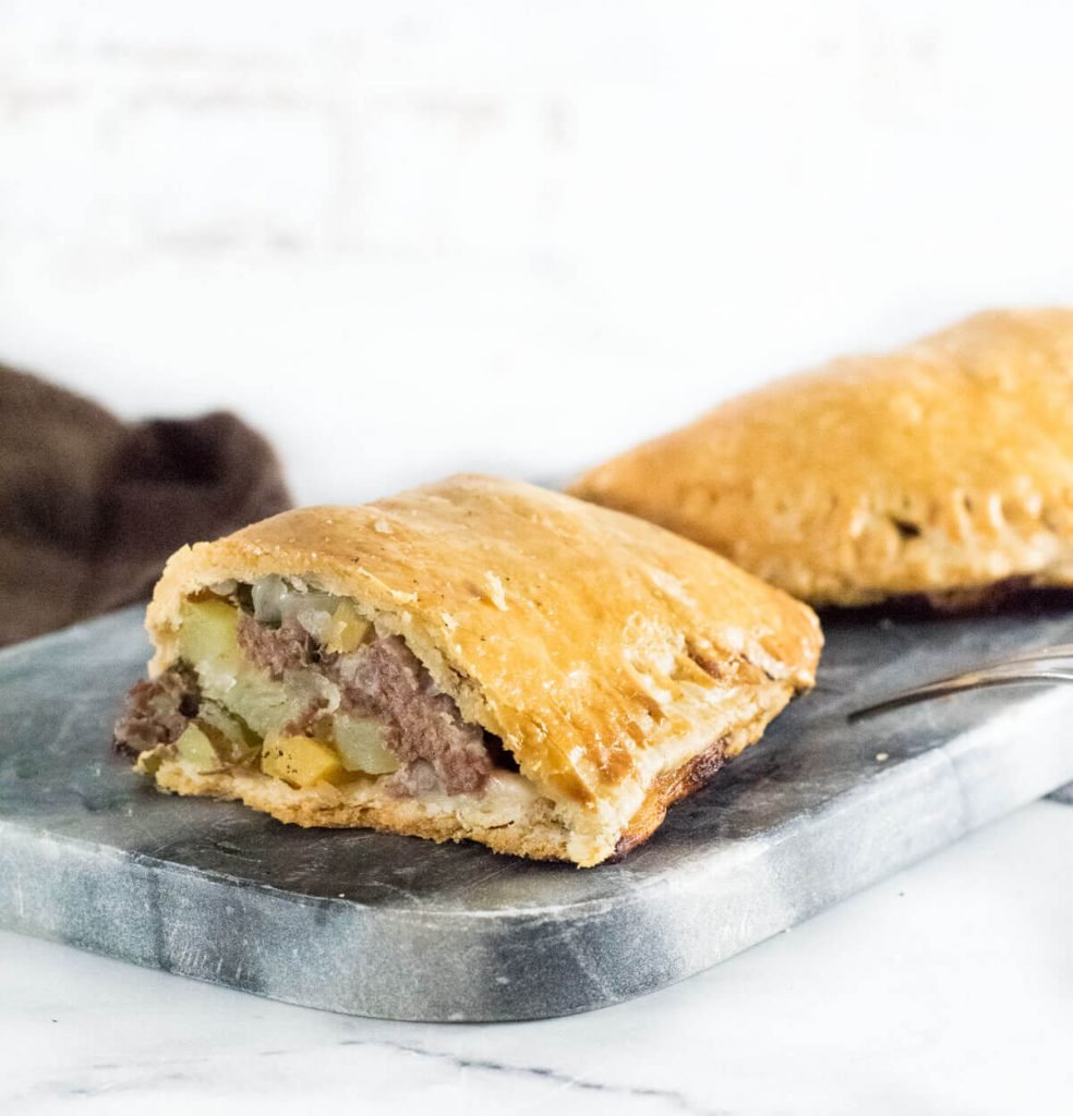 Michigan pasties cut open to show fillings.