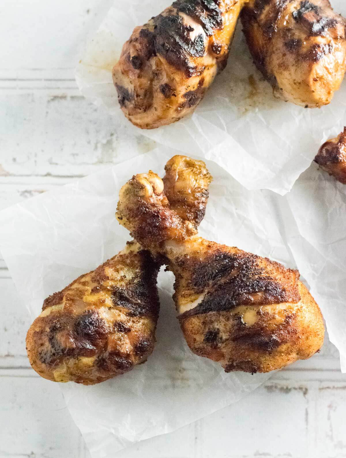 Sprice rubbed chicken drumsticks viewed from above.