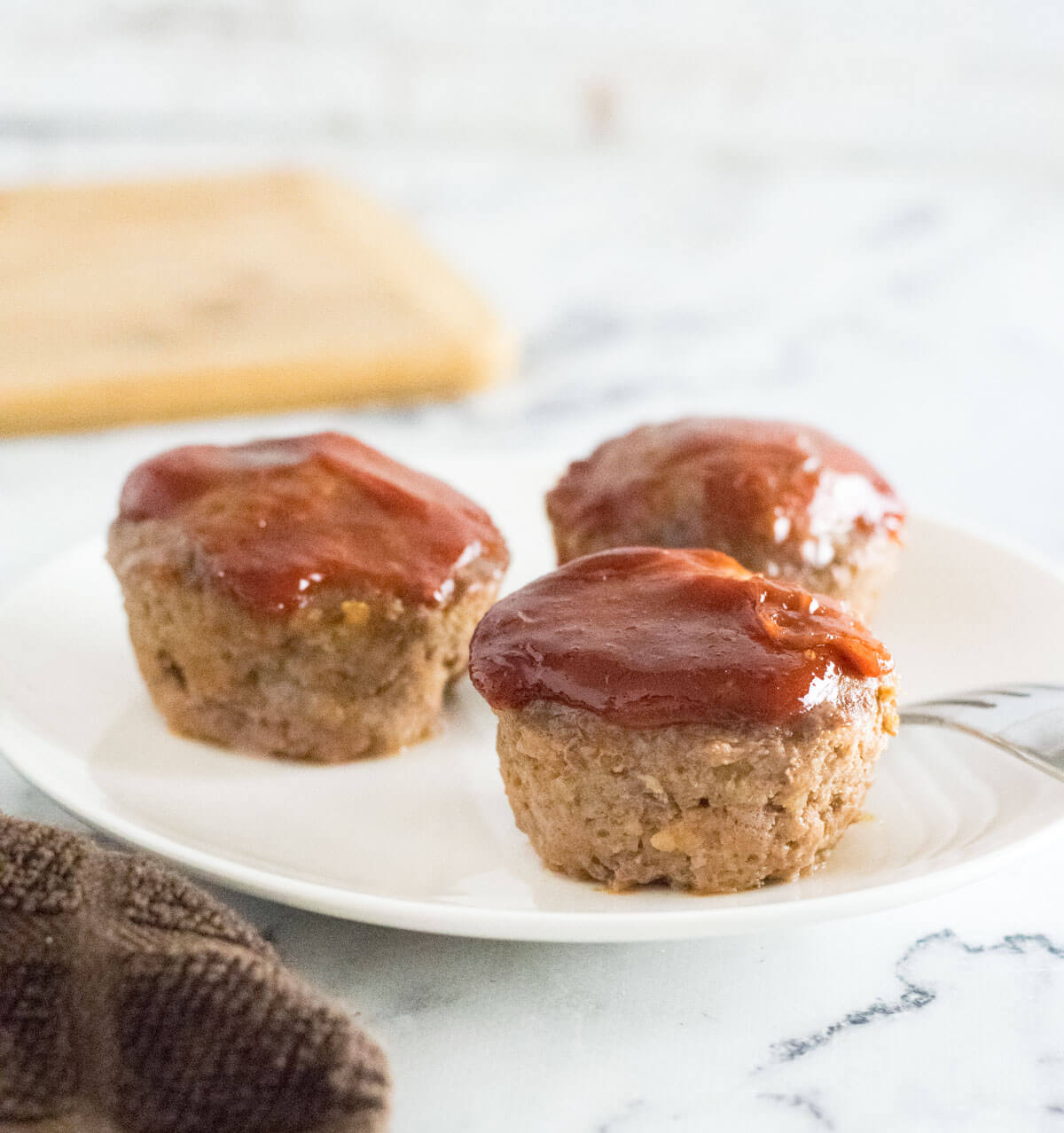 Mini Meatloaf Muffins on a white plate.
