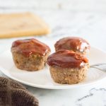 Three meatloaf muffins on plate.