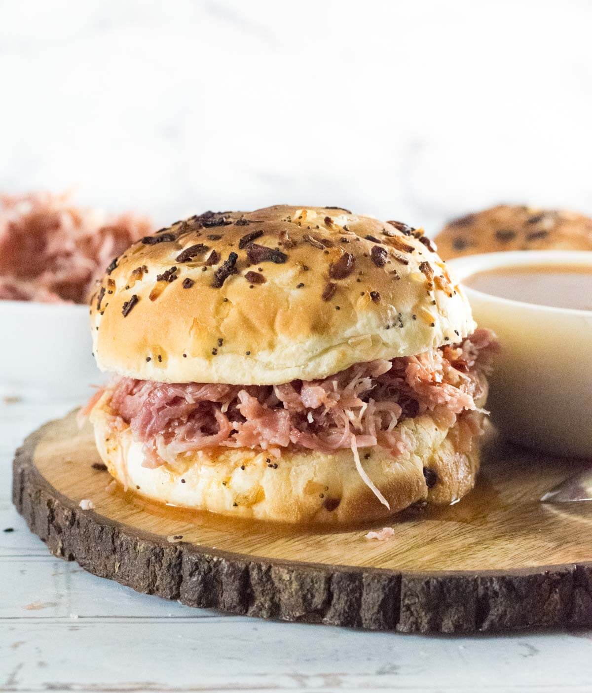 Pulled pork sandwich with finishing sauce.