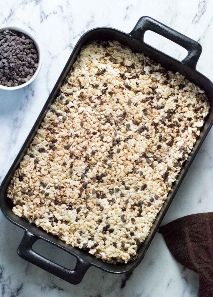 A pan of chocolate chip Rice Krispie treats, uncut.