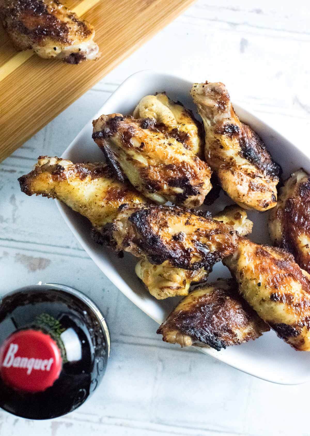 Brined chicken wings grilled and served.