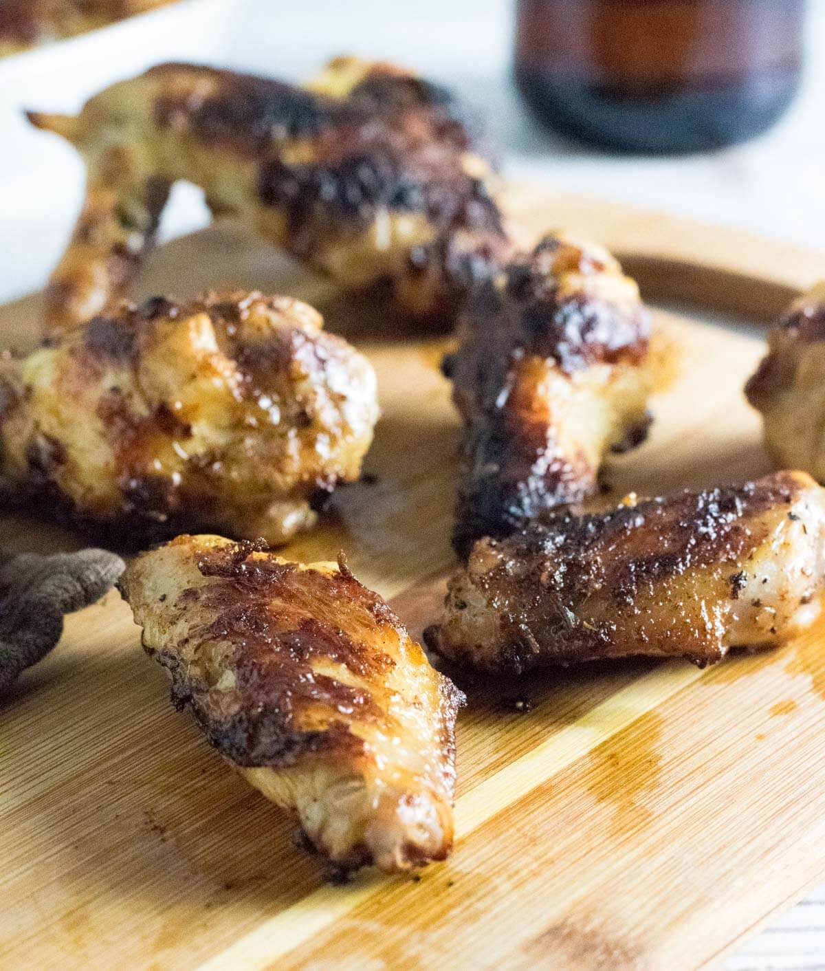 Brined chicken wings on cutting board.