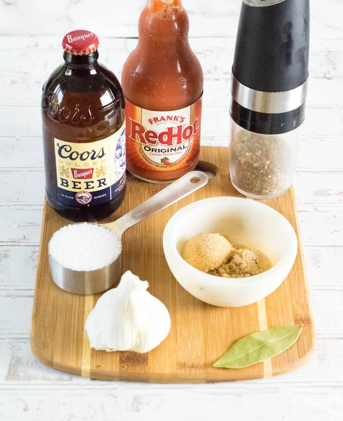 Chicken wings brine ingredients on board.
