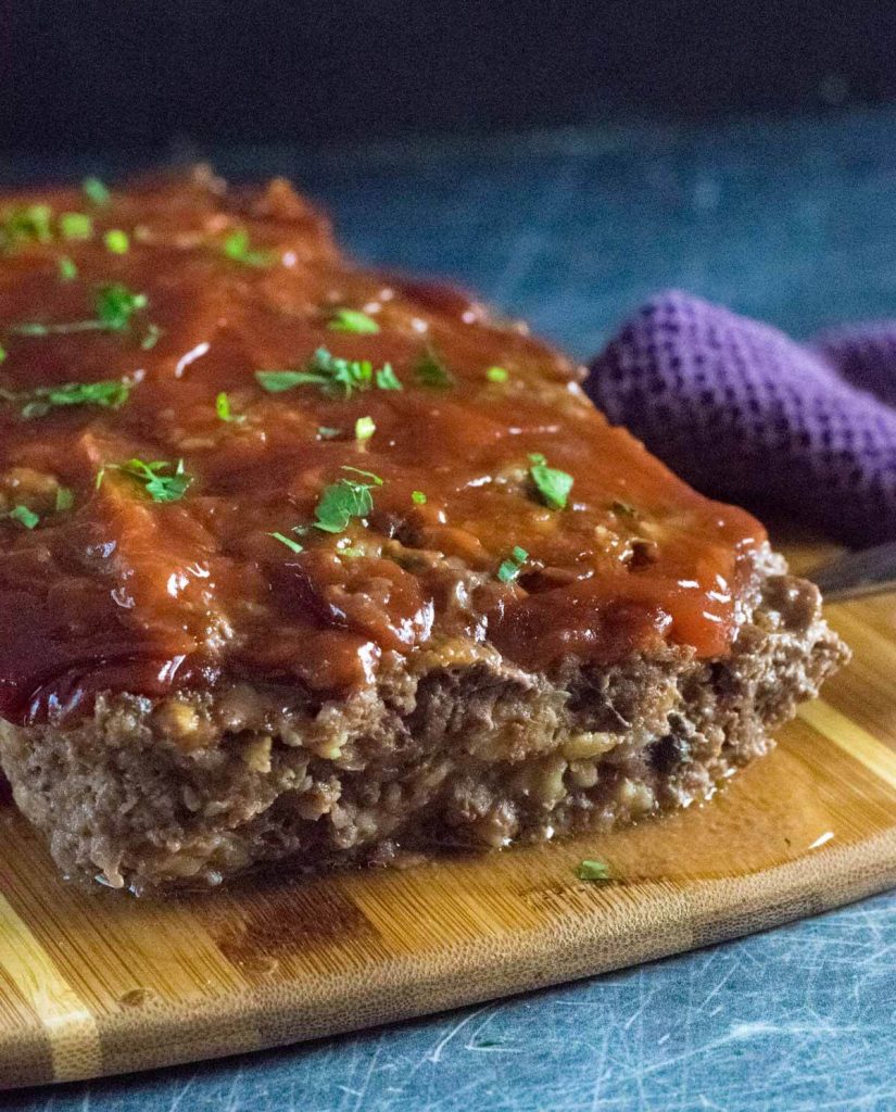 Meatloaf without breadcrumbs on a cutting board.