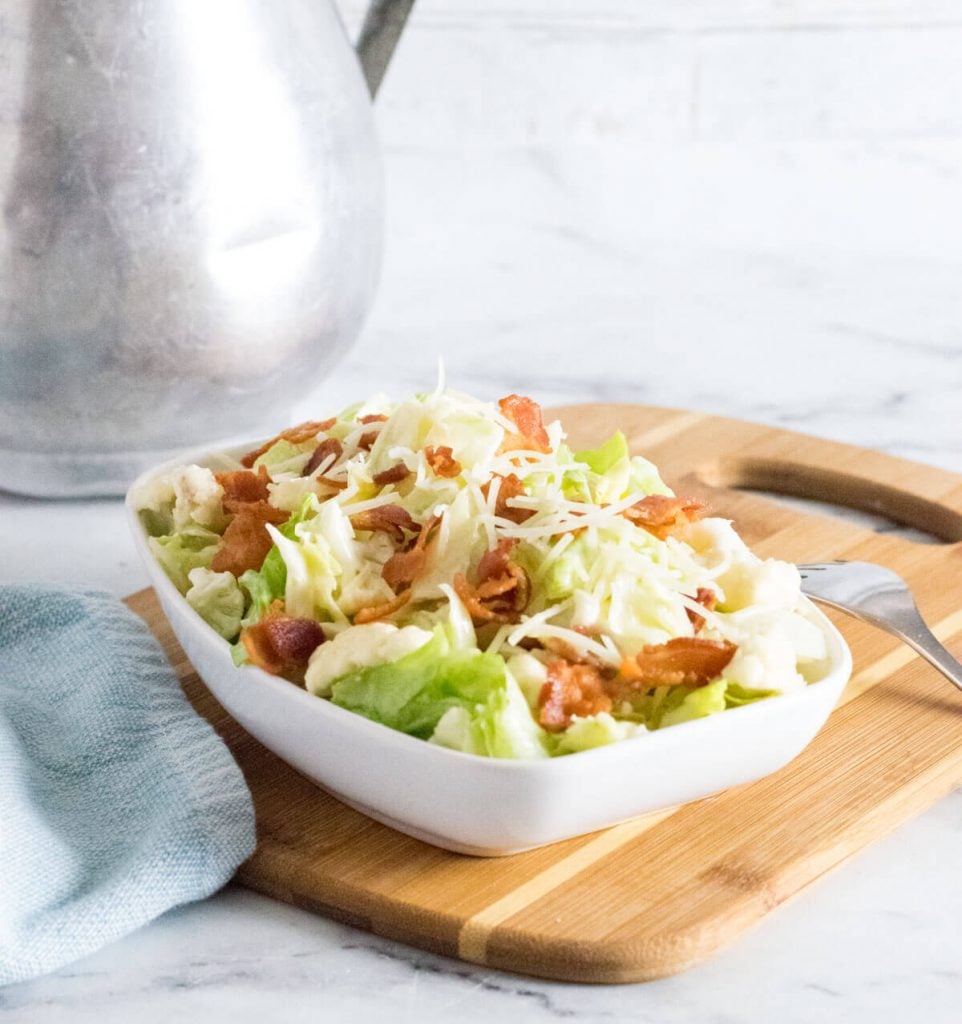 Tequilaberry's Salad on a cutting board in a white bowl.