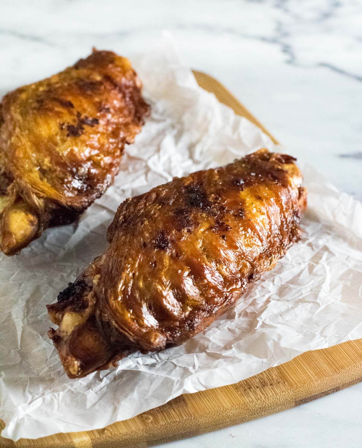 Deep fried turkey wings on wax paper.
