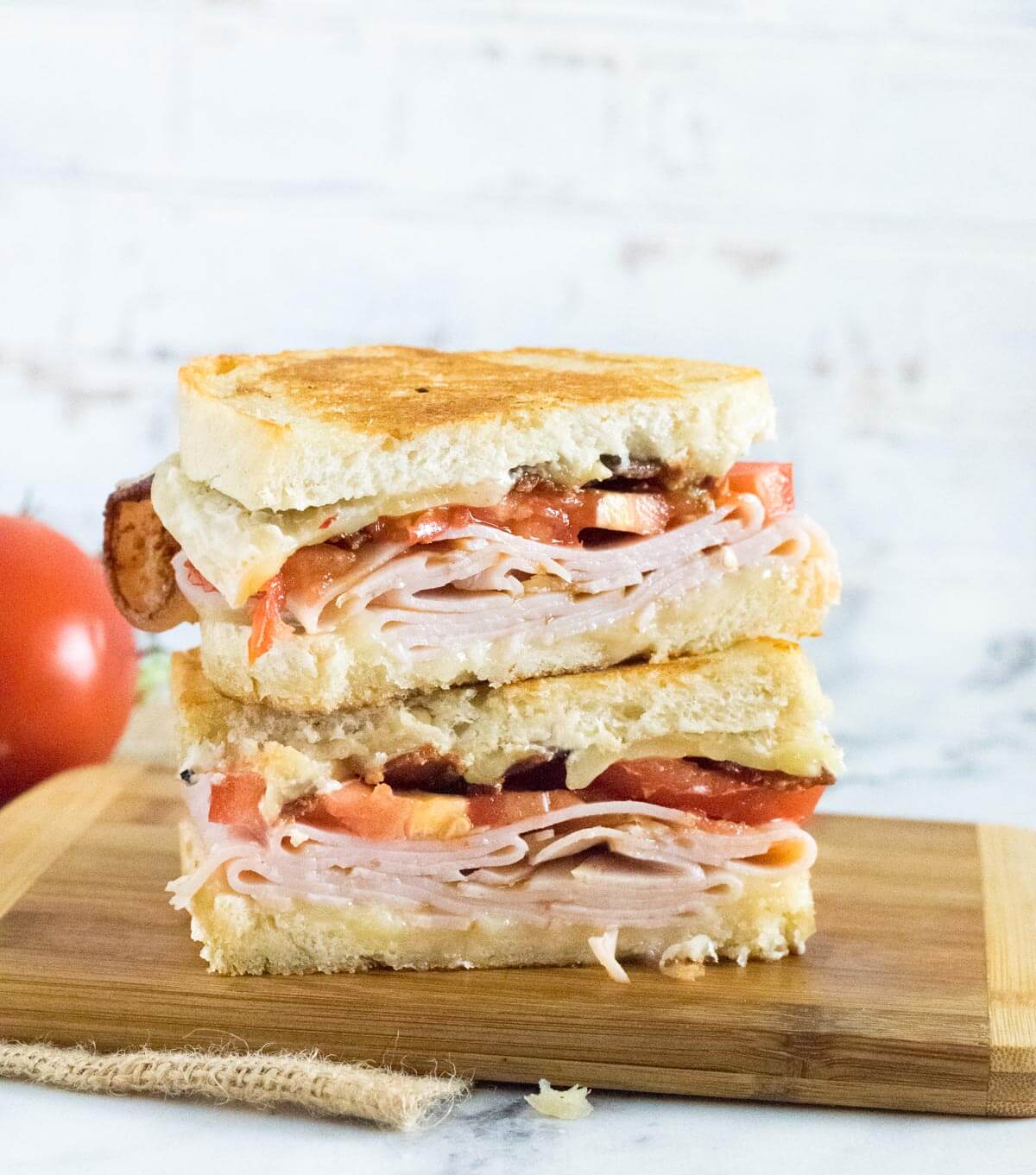 Sliced turkey melt sandwich.