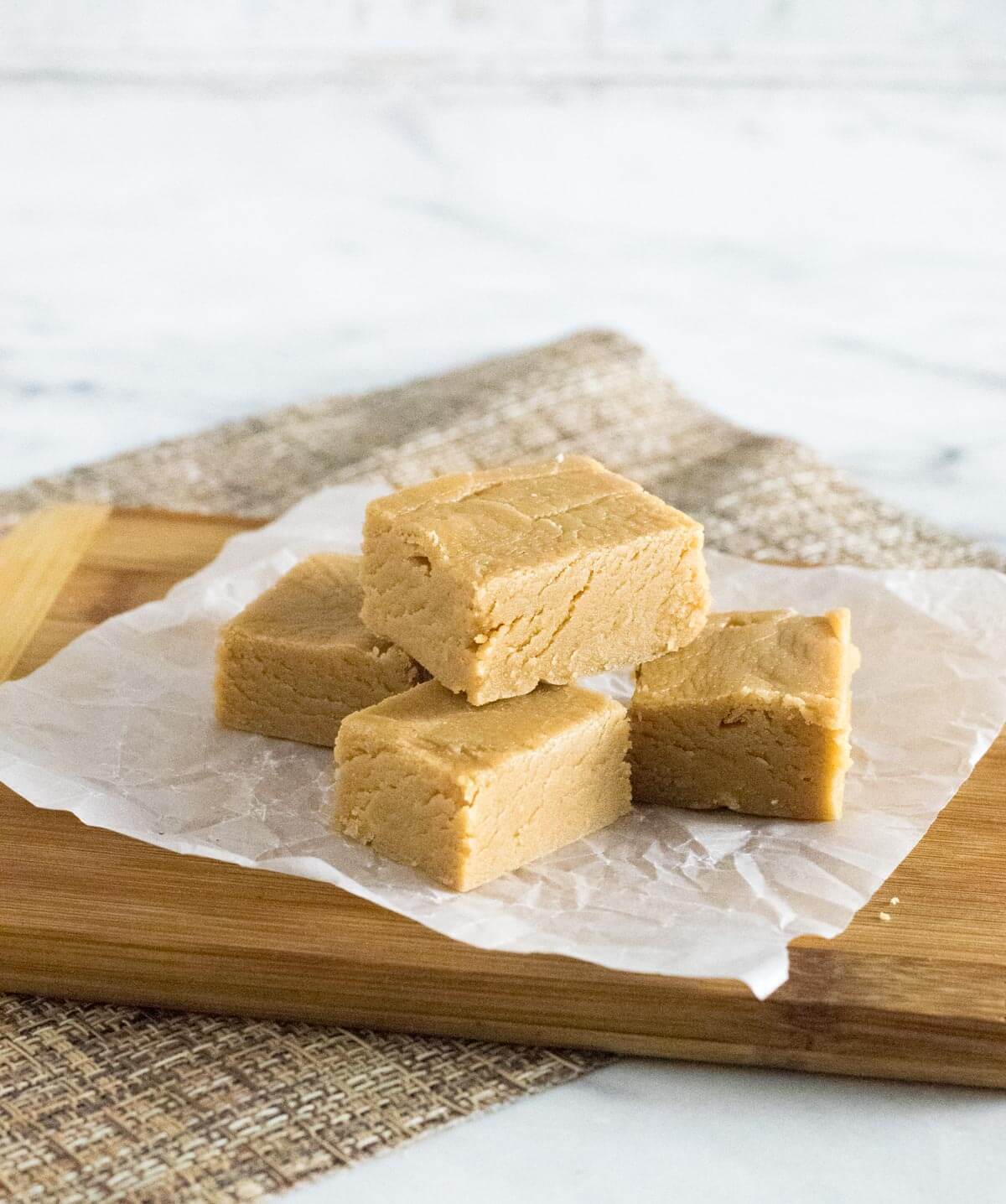 Old fashioned peanut butter fudge on wax paper.