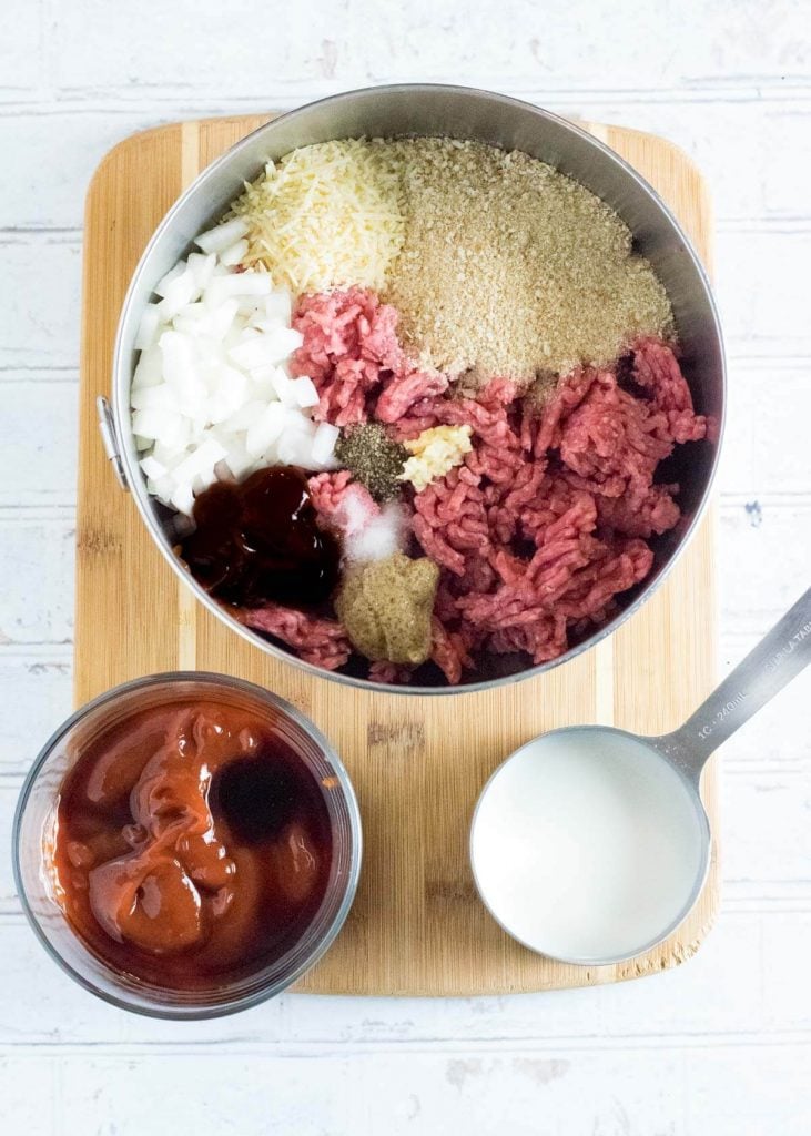 Meatloaf ingredients without eggs shown in mixing bowl.