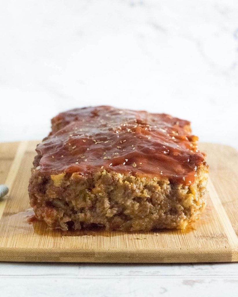 Meatloaf without eggs on cutting board.