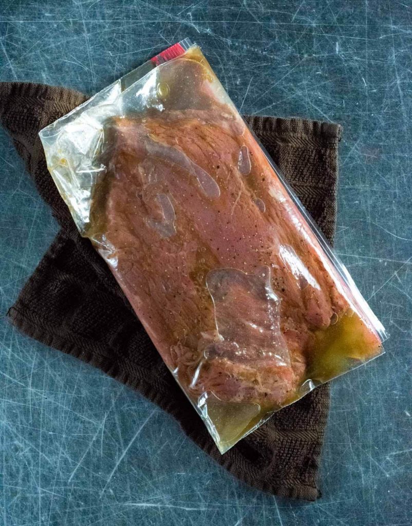Flank steak marinating in bag.