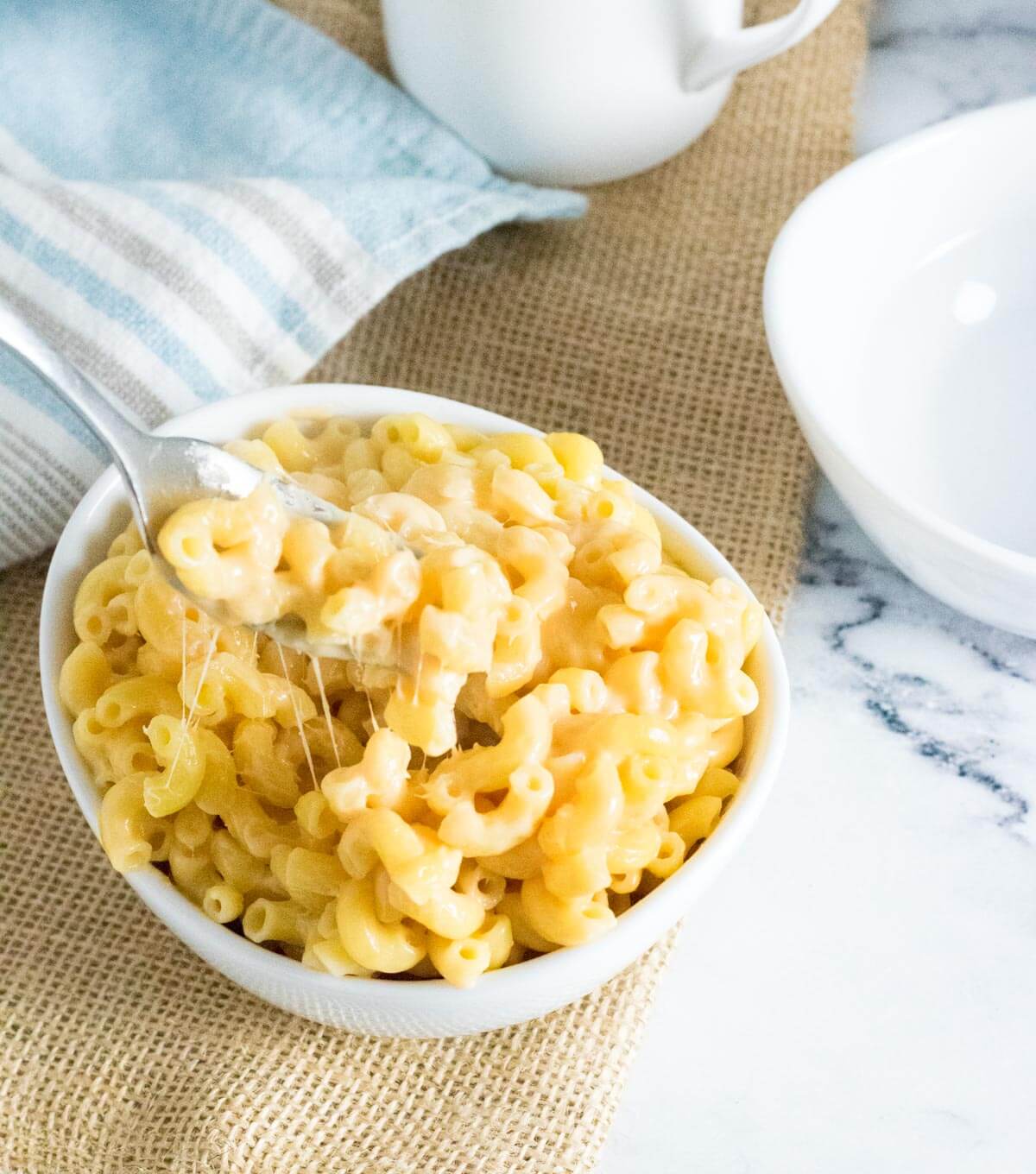Reheated mac and cheese eaten with fork.