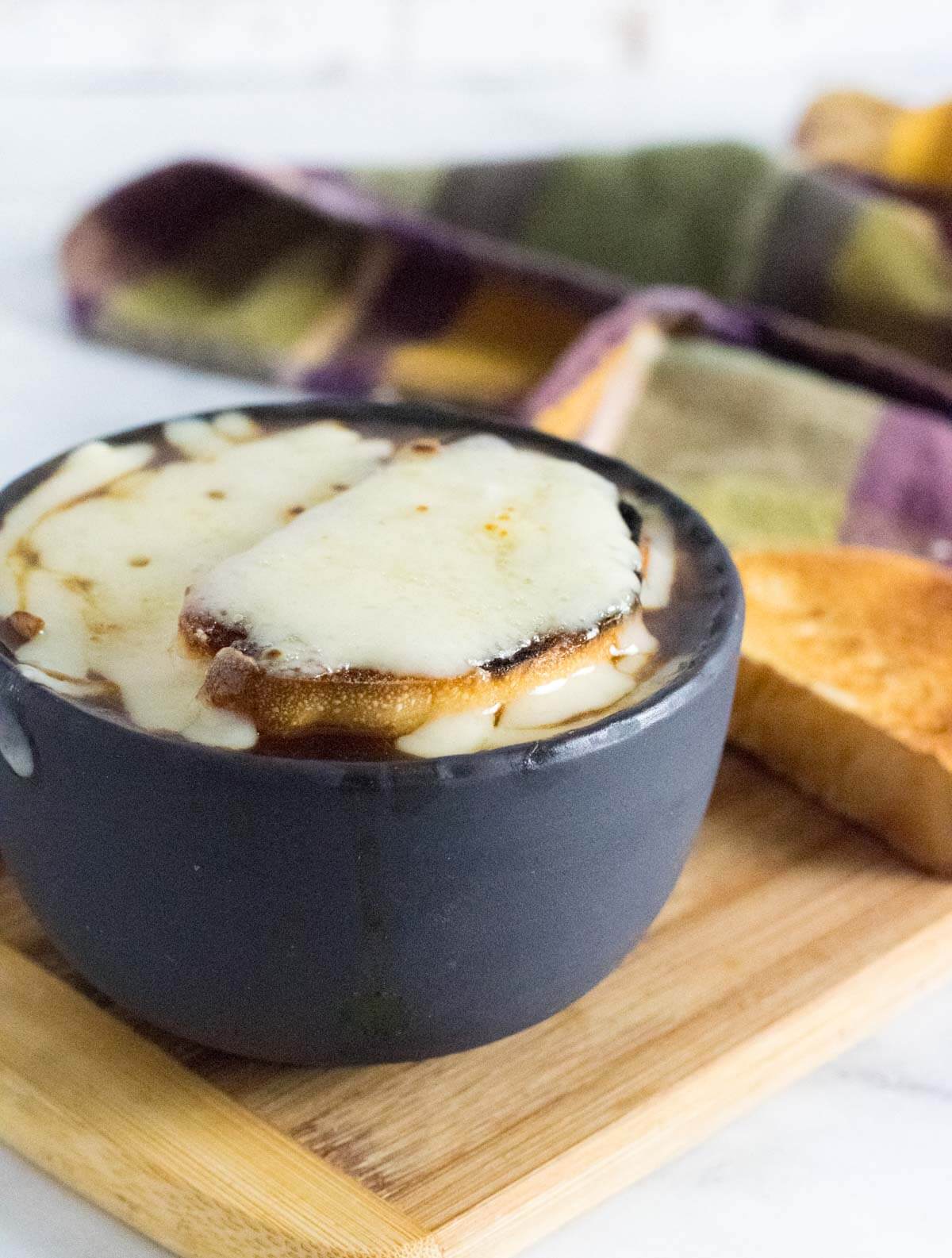 French onion soup without wine topped with cheesy toast.