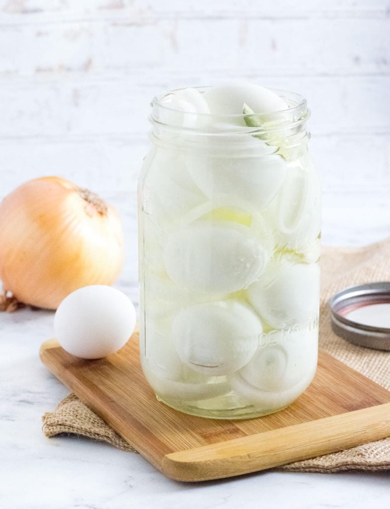 Old fashioned pickled eggs in glass jar.