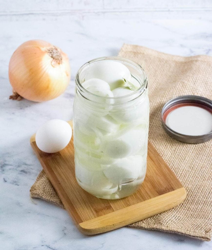 Storing pickled eggs in a jar.