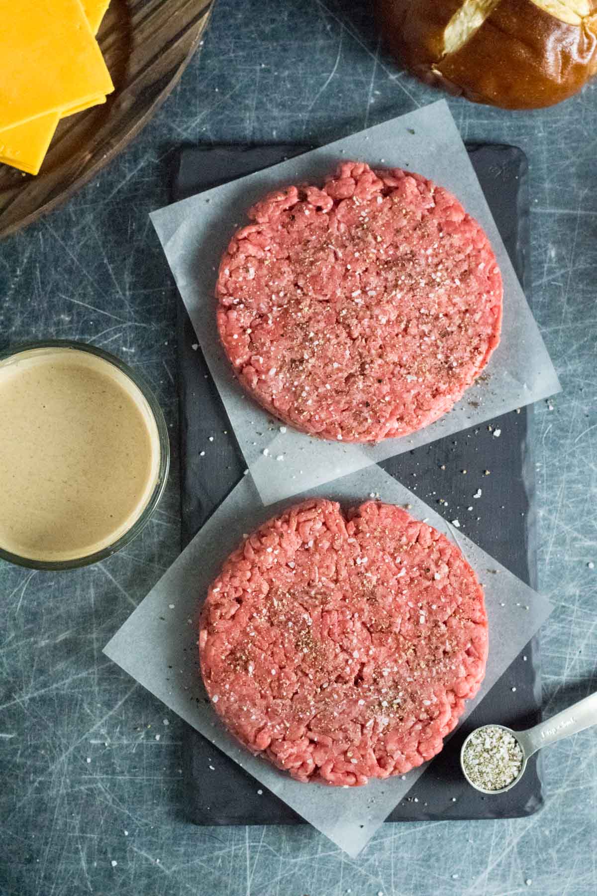 Forming raw hamburger patties.