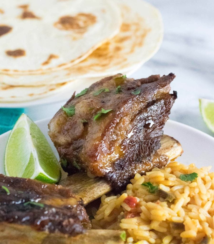 Mexican short ribs served with rice.