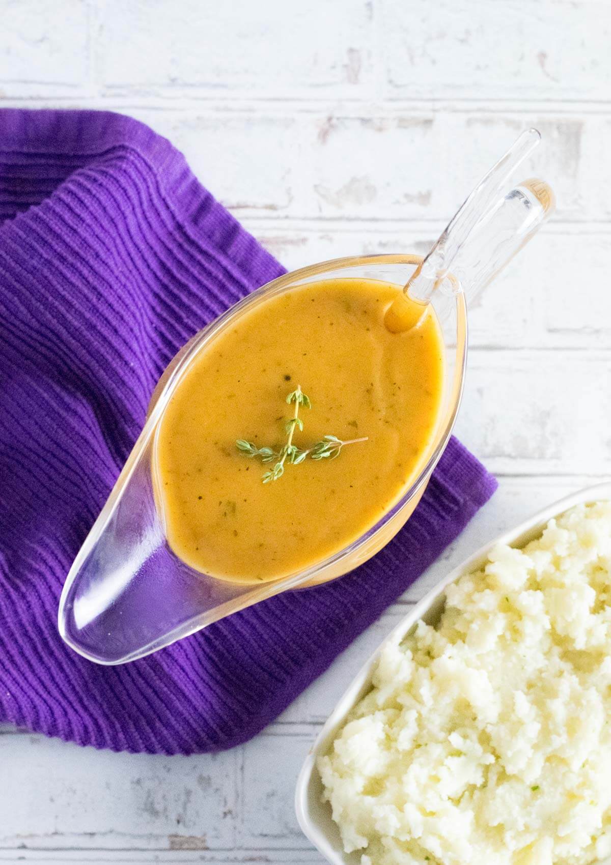 Serving Cajun gravy with mashed potatoes.