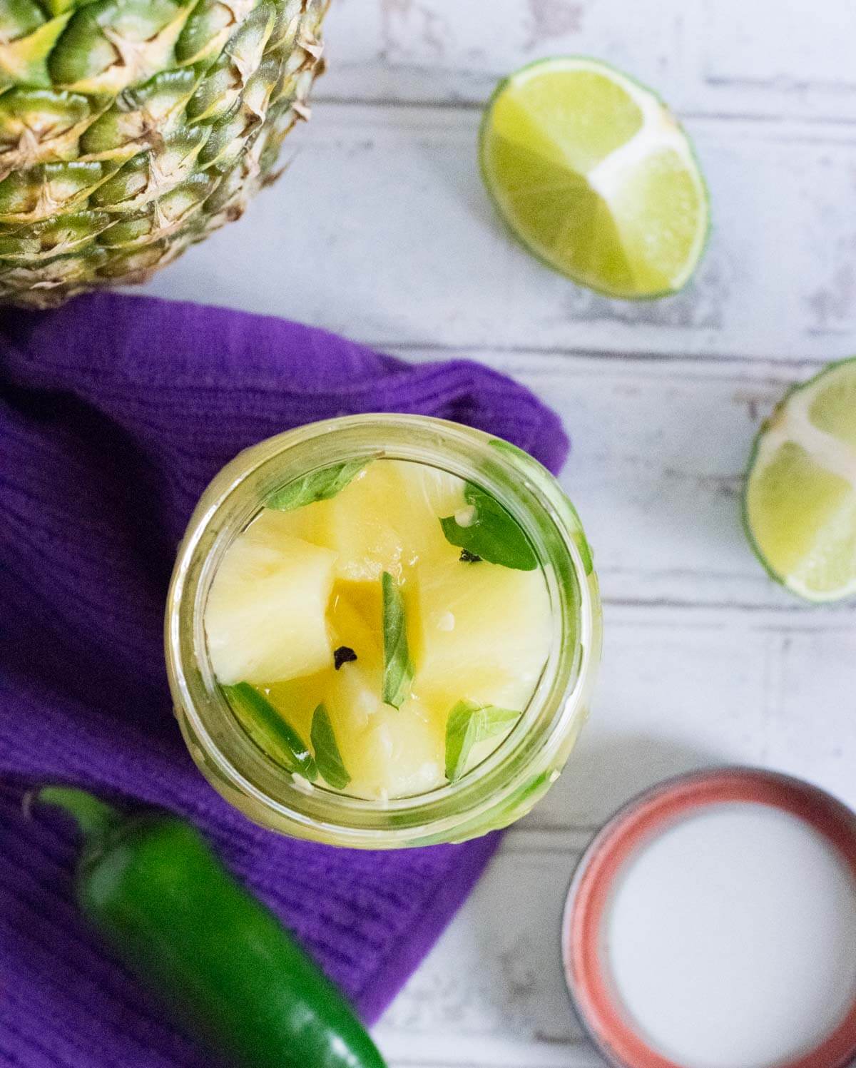 Pickled pineapple in a quart jar.