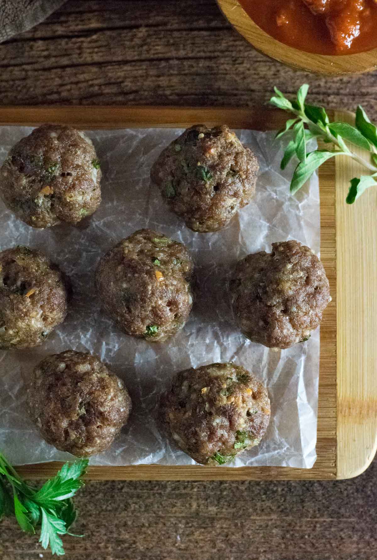 Serving egg-free meatballs with sauce.