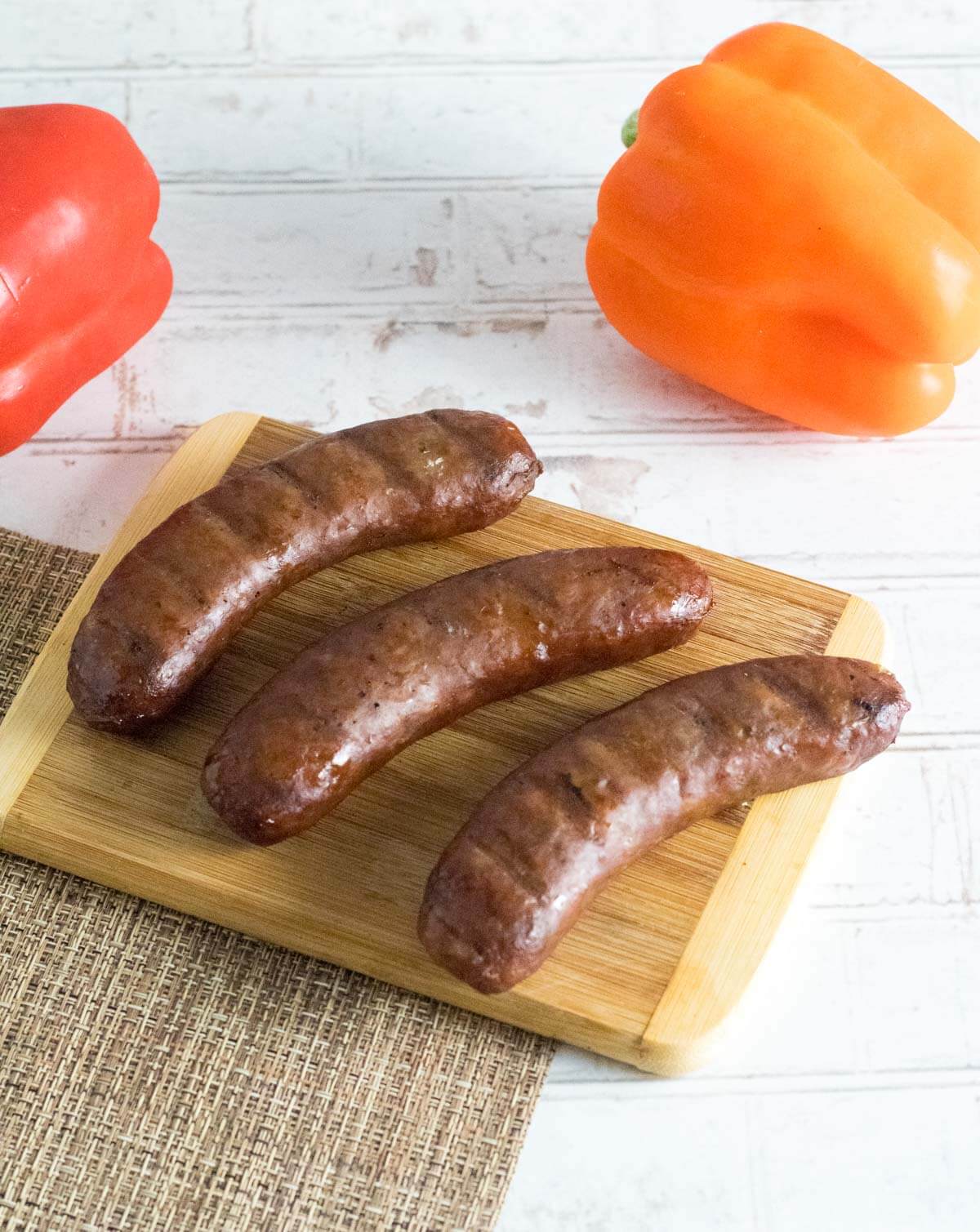 Smoked Italian sausage on cutting board.