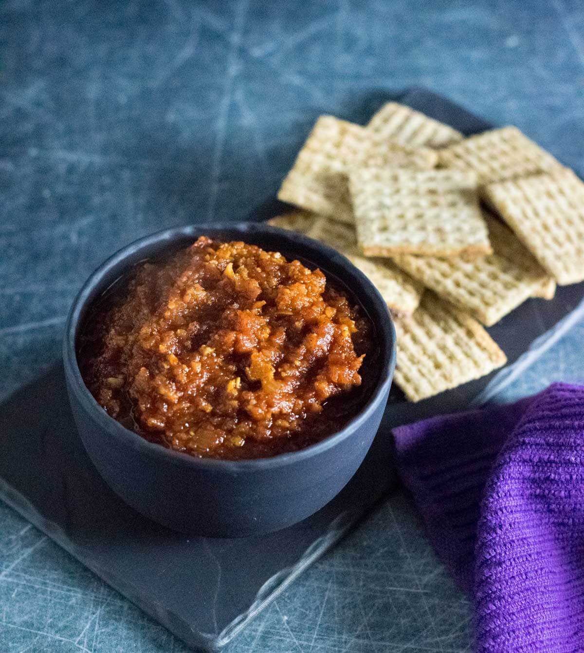 Tomato bacon jam served in a bowl.